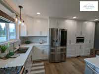 Custom kitchen with white cabinets and stainless appliances, designed by Hint of Honey