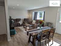 Spacious bright and open dining area and living room, designed by Hint of Honey