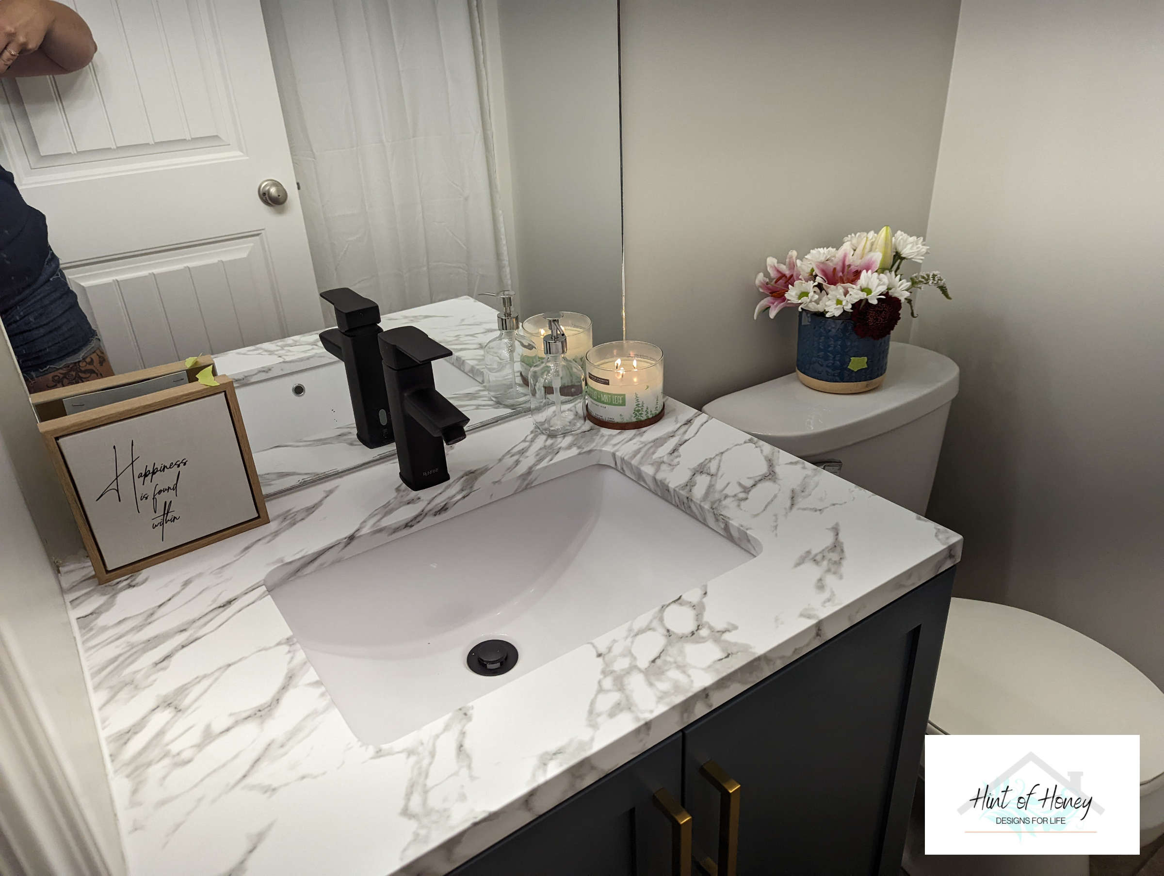 Modern bathroom with marbled countertop - Hint of Honey