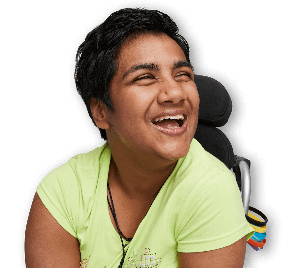 Marush has short black hair and is wearing a light green t-shirt. Marush is a wheelchair user.