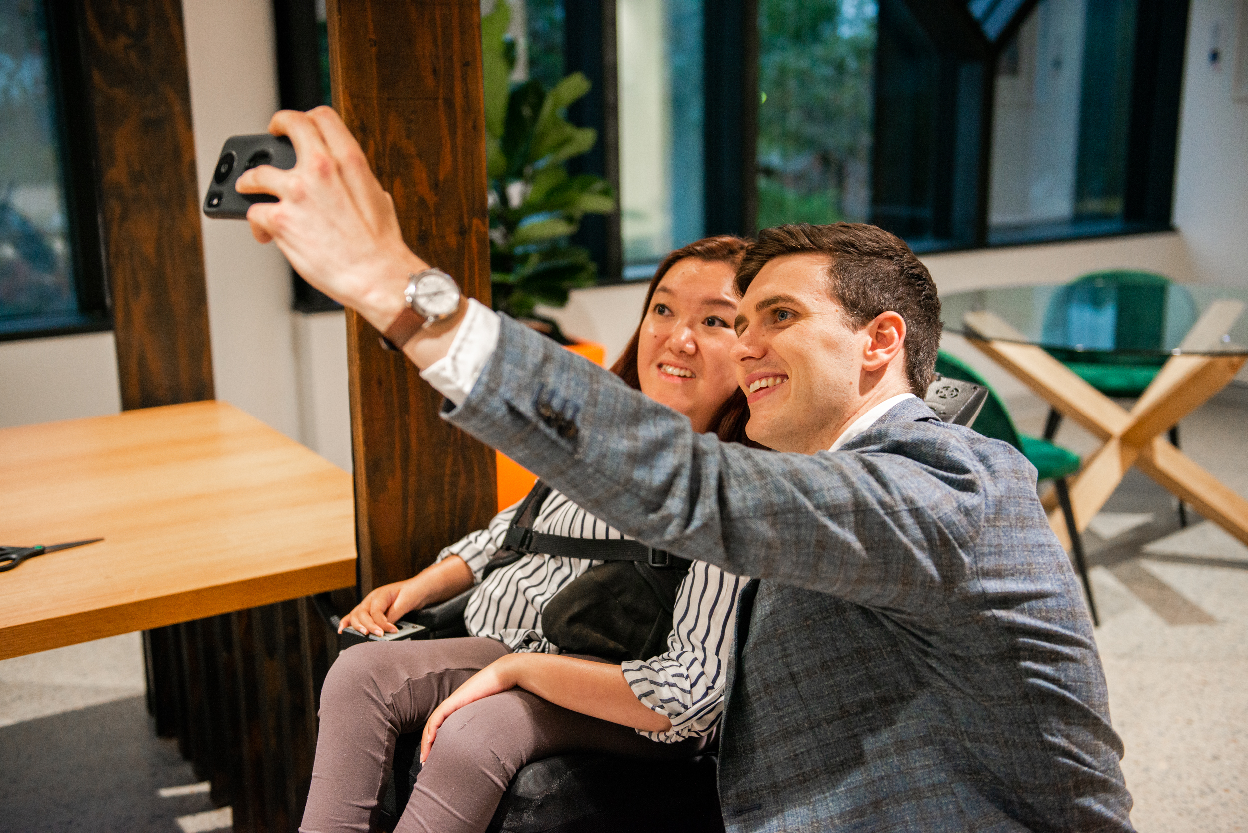 Mel Tran and Jordan O'Reilly taking a selfie together.