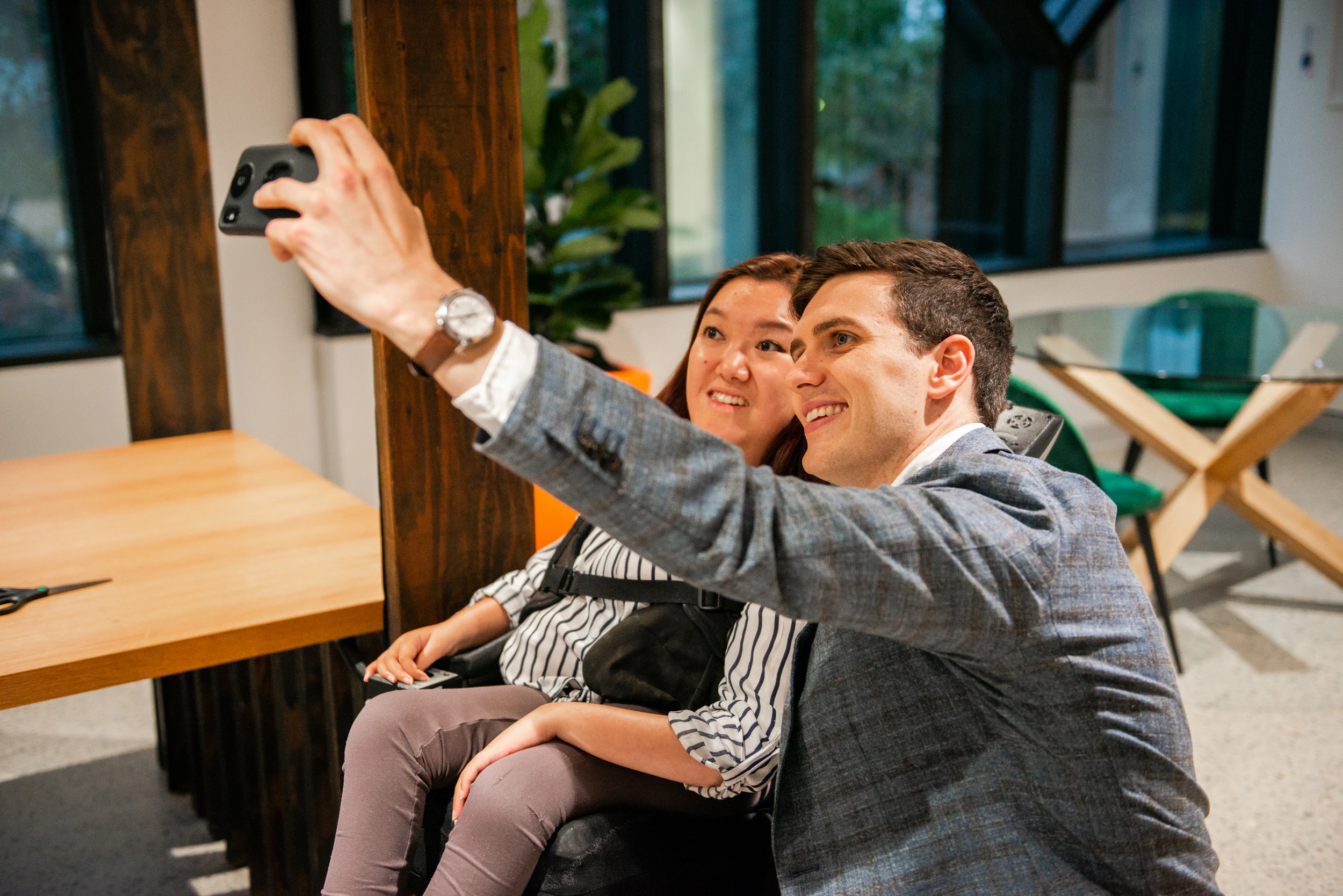 Mel Tran and Jordan O'Reilly taking a selfie together.
