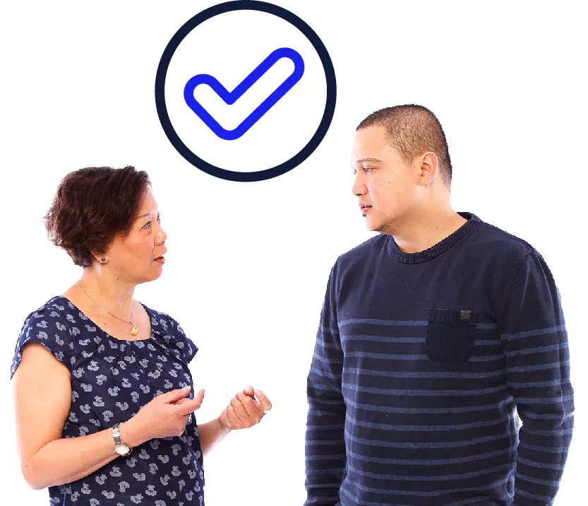 A tick next to a person having a conversation with a support worker.