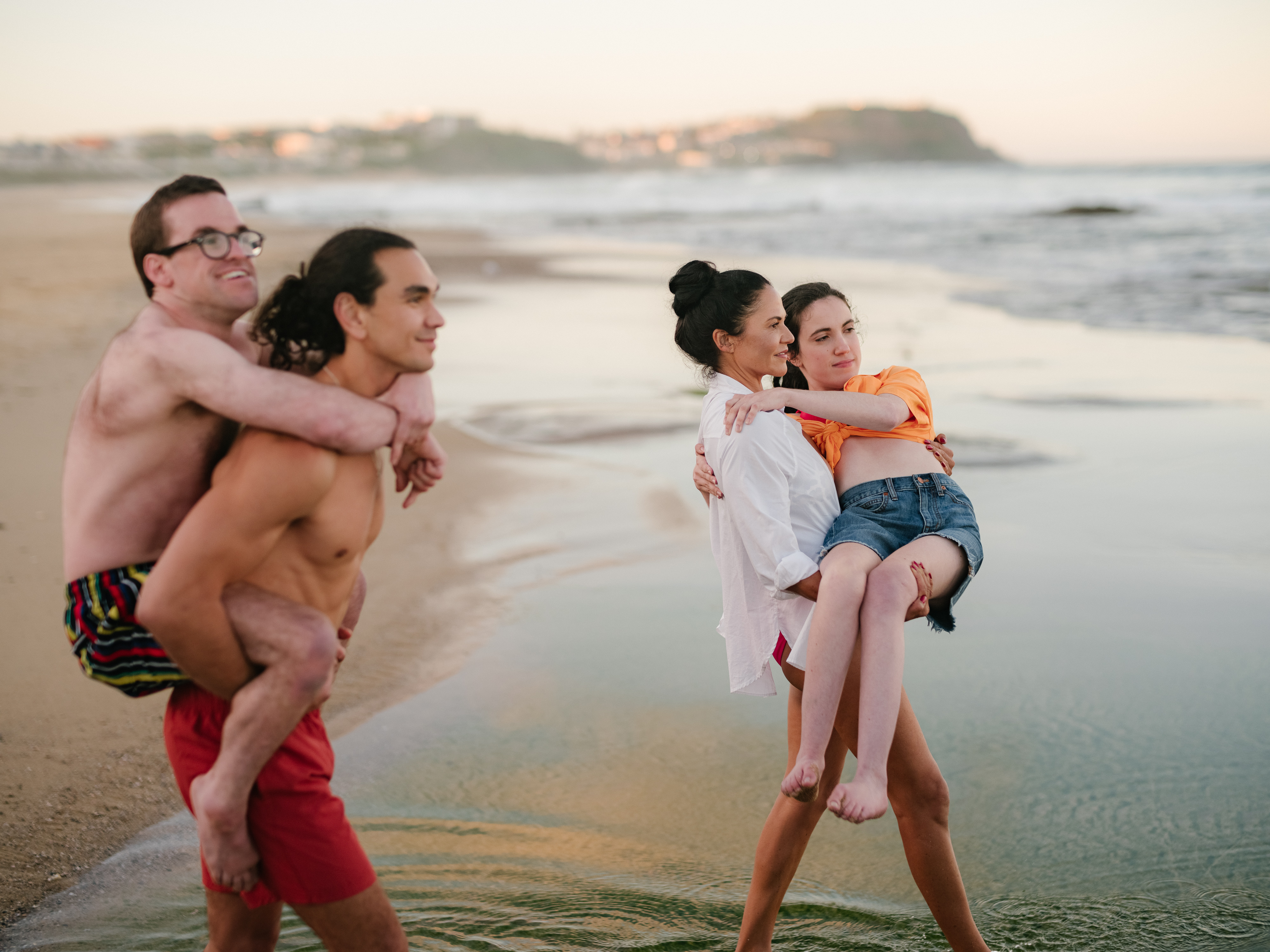 The lead cast of SBS show Latecomers on a beach.