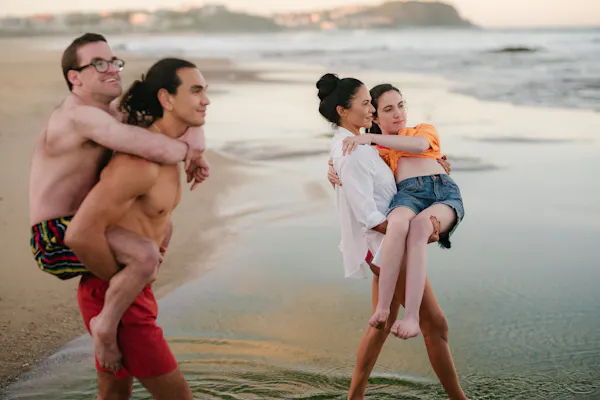 The lead cast of SBS show Latecomers on a beach.