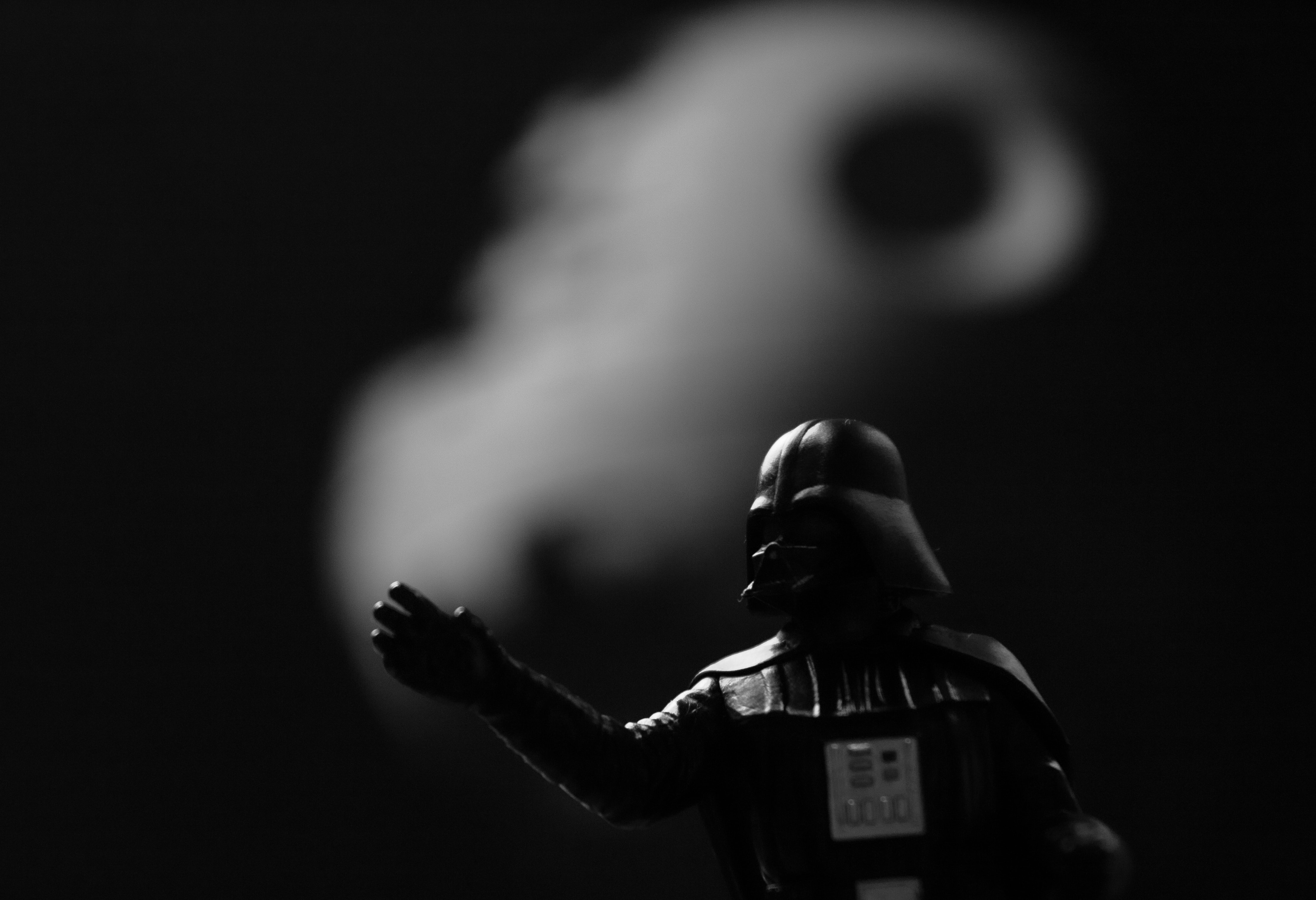 Image shows Darth Vader from the Star Wars movie in the foreground with the Death Star in the background.  Photo by Piotr Makowski on Unsplash.