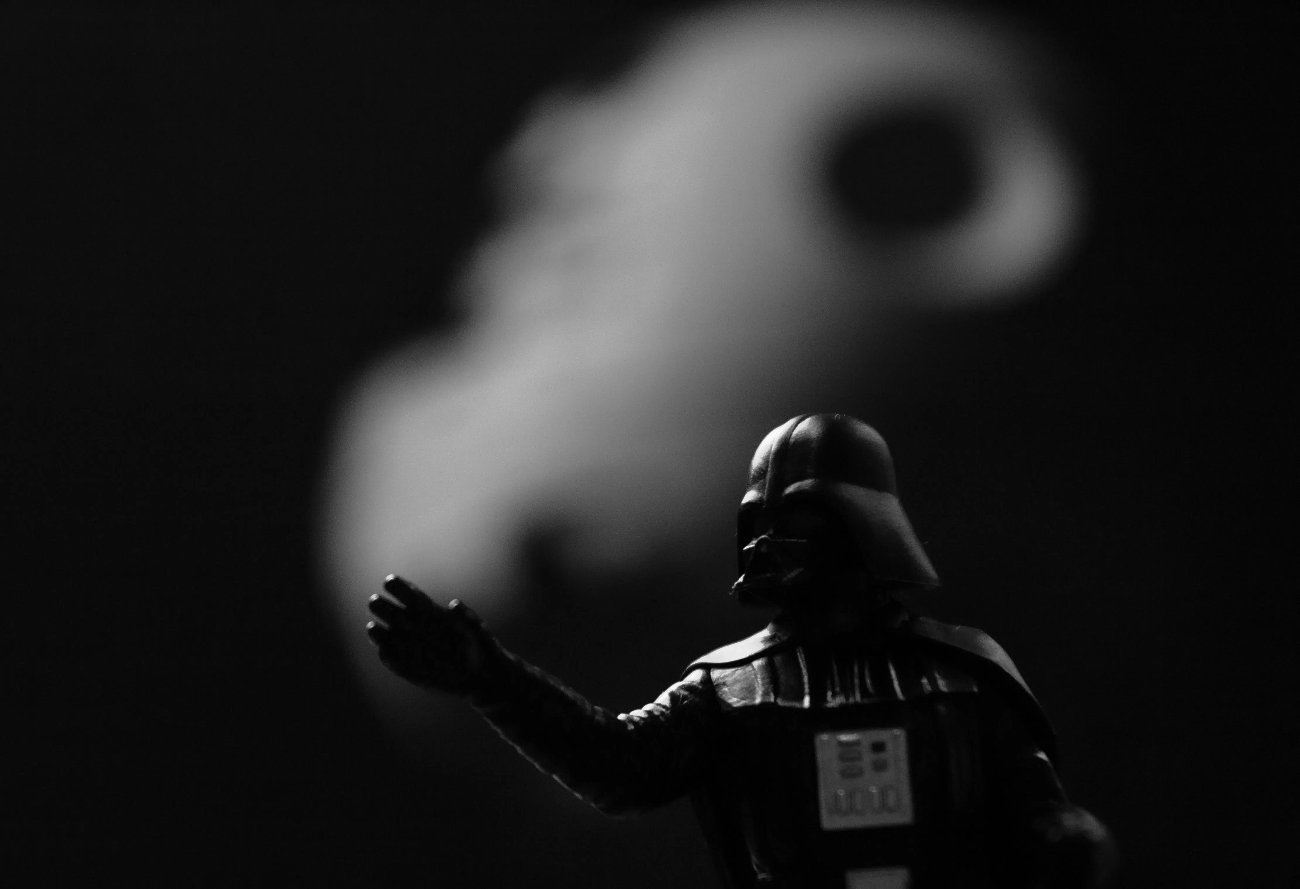 Image shows Darth Vader from the Star Wars movie in the foreground with the Death Star in the background.  Photo by Piotr Makowski on Unsplash.