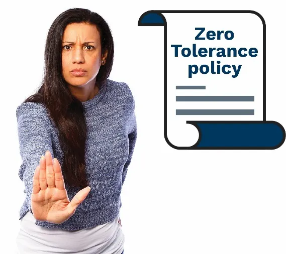 A woman holding out her hand to stay stop. She has a policy icon with a zero tolerance policy on it next to her