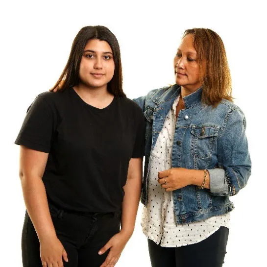 A woman puts her hand on another woman's shoulder.