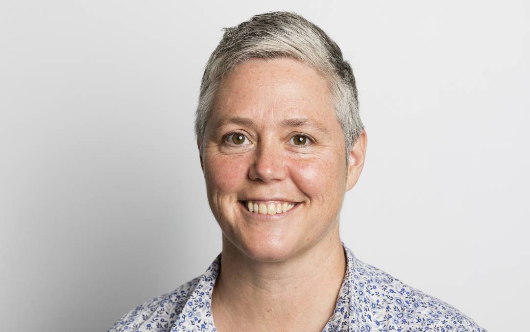 NDS CEO Laurie Leigh has short silver hair and smiles at the camera. 