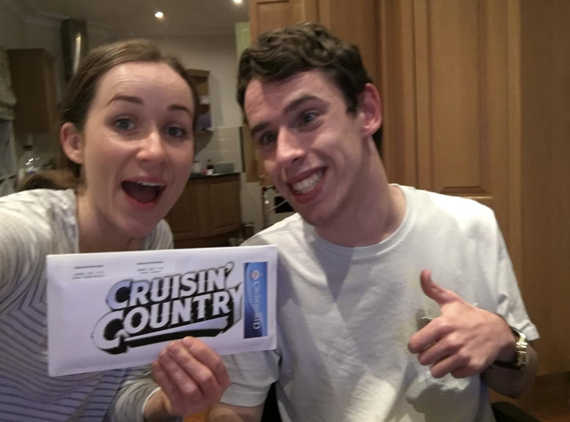 Hireup support worker Sarah and her client Dan, holding their 'Cruisin' Country' cruise tickets 