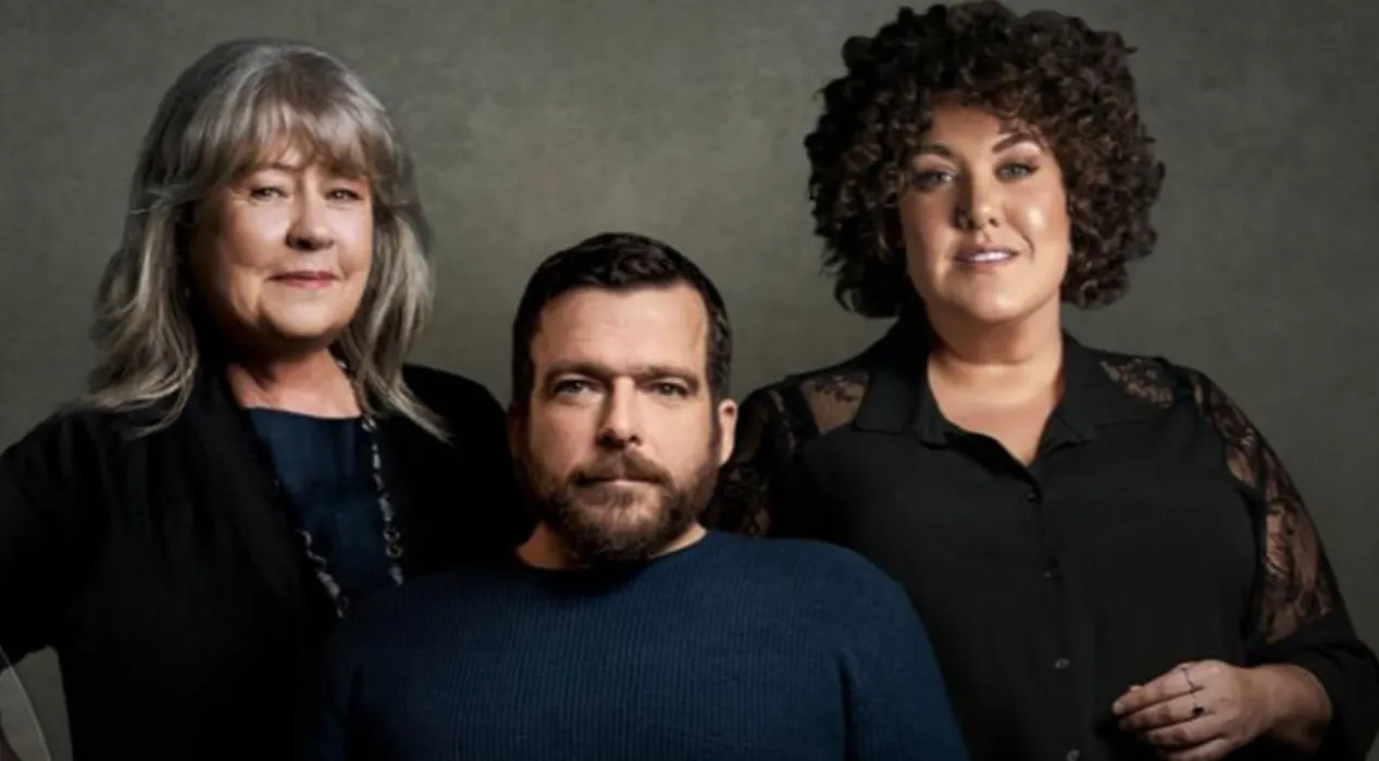 Noni Hazlehurst, Kurt Fearnley and Casey Donovan look down the camera.