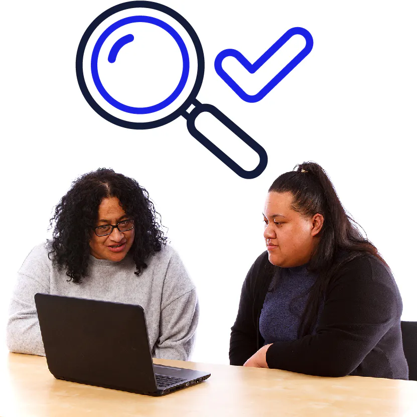 A support worker showing someone else information on a laptop. Above them are a magnifying glass and a tick.