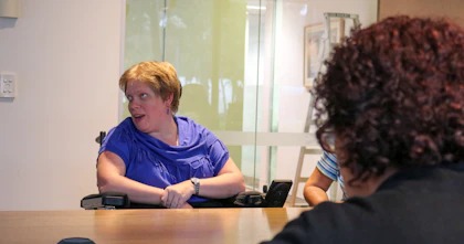 Mel speaking with a panel at Hireup
