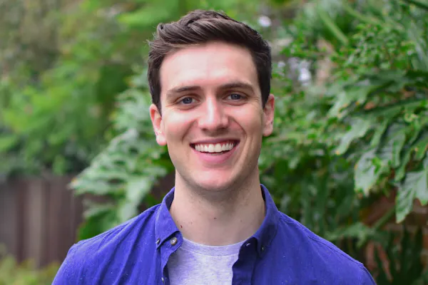 A headshot of Jordan O'Reilly. He's looking at the camera and smiling.