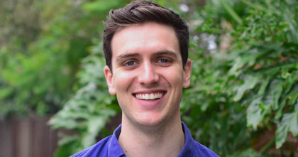A headshot of Jordan O'Reilly. He's looking at the camera and smiling.