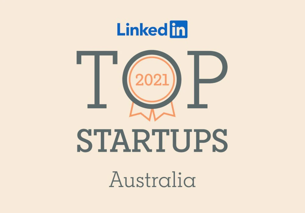 LinkedIn's logo sits above large writing that reads "Top Startups Australia." A ribbon with the year 2021 sits inside the 'o' of the word 'top'.