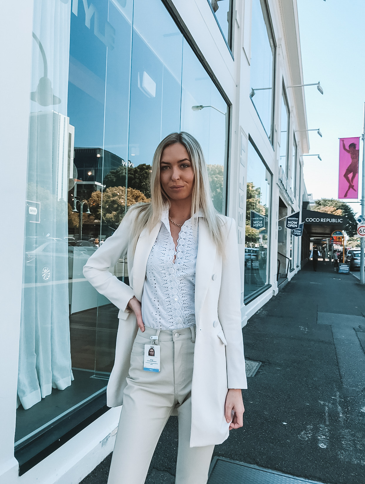 Disability advocate and Champion Health Agency founder, Anja Christoffersen, stands on a city street. 