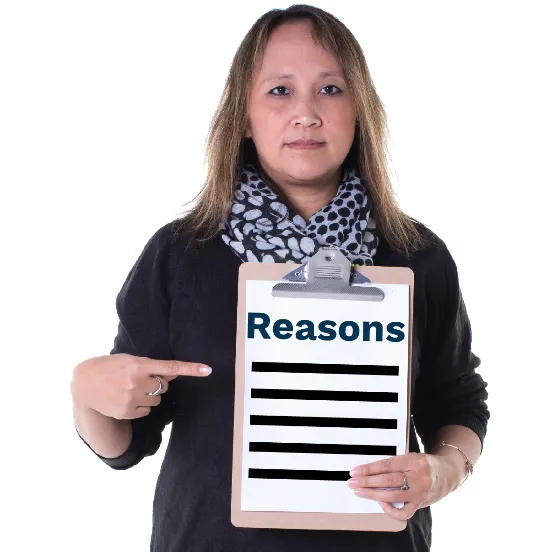 A woman pointing to a list of reasons 