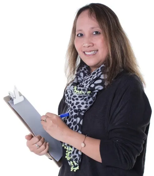 A woman writing on a clipboard