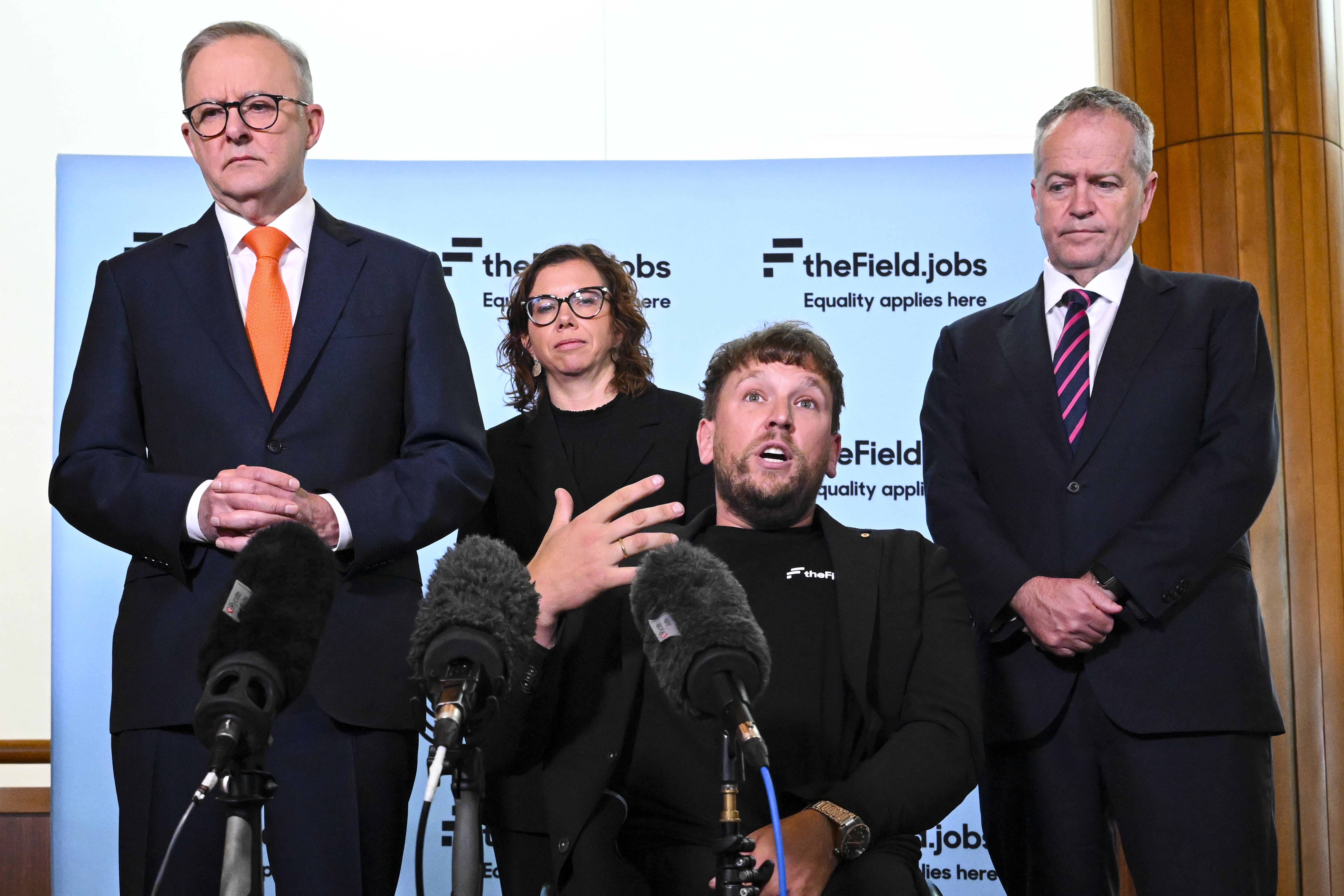2022 Australian of the Year Dylan Alcott speaks to the media surrounded by Australian Prime Minister Anthony Albanese, Australian Minister for the National Disability Insurance Scheme Bill Shorten and Minister for Social Services Amanda Rishworth during the launch of disability employment website ‘The Field’, at Parliament House in Canberra, Wednesday, November 9, 2022. 