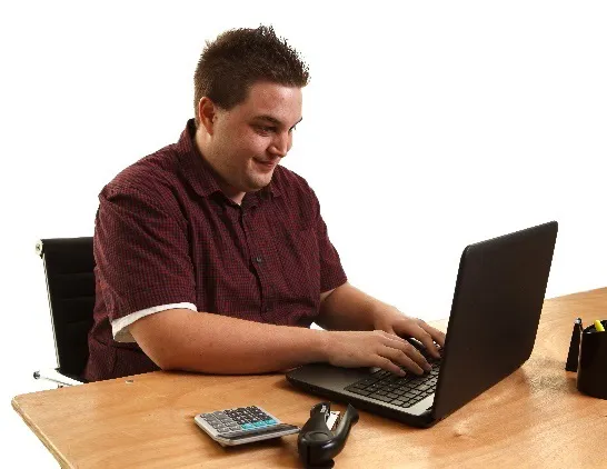 A man on a computer.