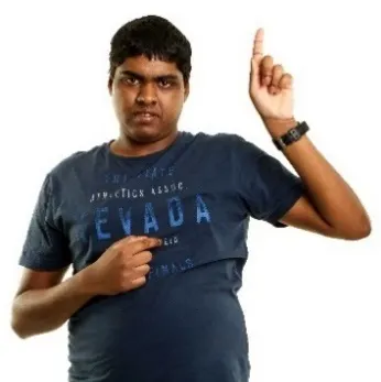 A person pointing to themselves with the other hand raised.