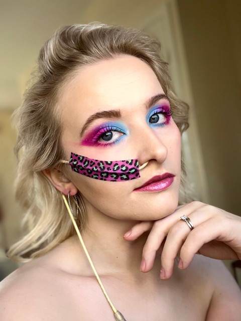 Megan Fisher, 'The Chronic Makeup Artist', has blue and pink eye shadow to match her colourful NG tube tape. 
