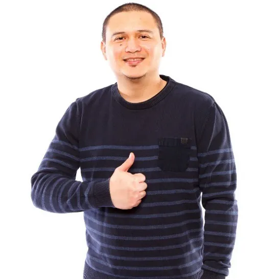 A man with his thumbs up.