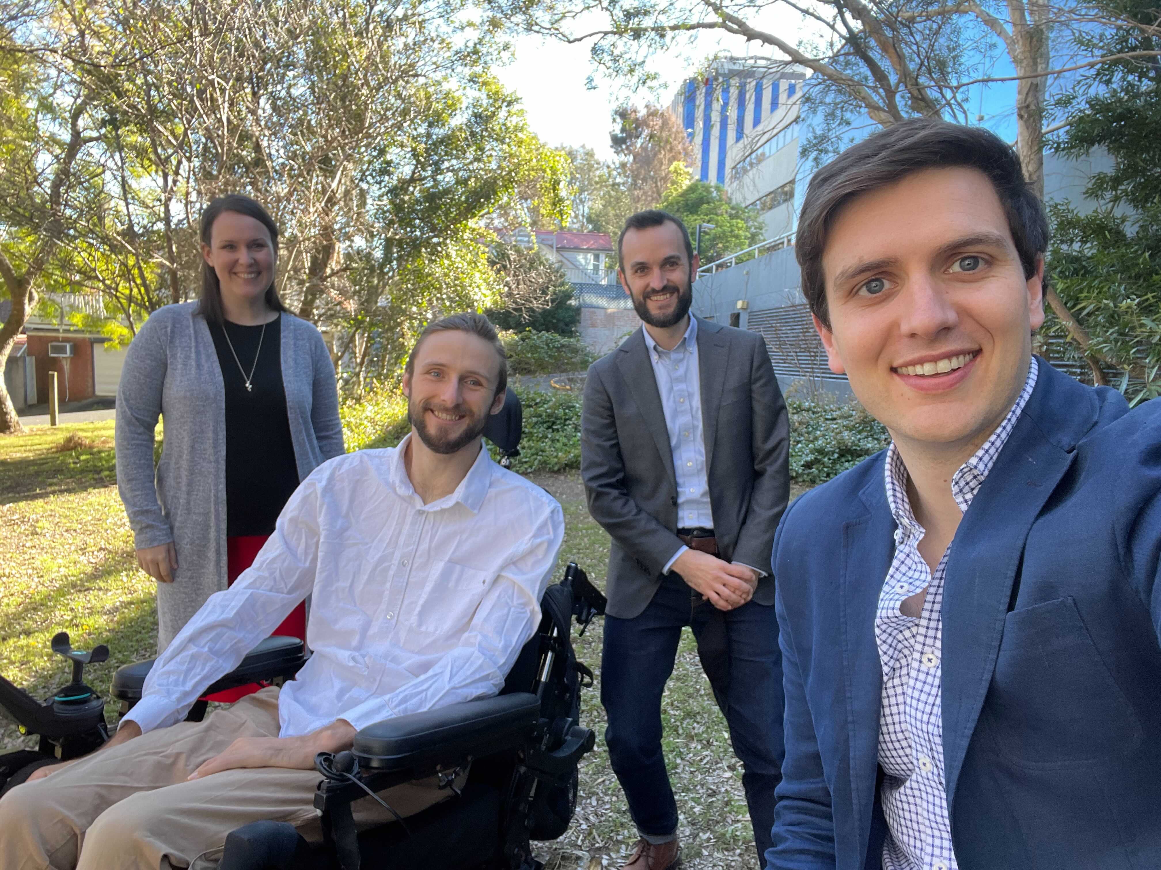 Hireup's first Board observer Steve Ralph with Hireup founders Jordan and Laura O'Reilly and Murray Bunton. They are outdoors with tress behind them.