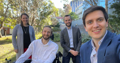 Hireup's first Board observer Steve Ralph with Hireup founders Jordan and Laura O'Reilly and Murray Bunton. They are outdoors with tress behind them.
