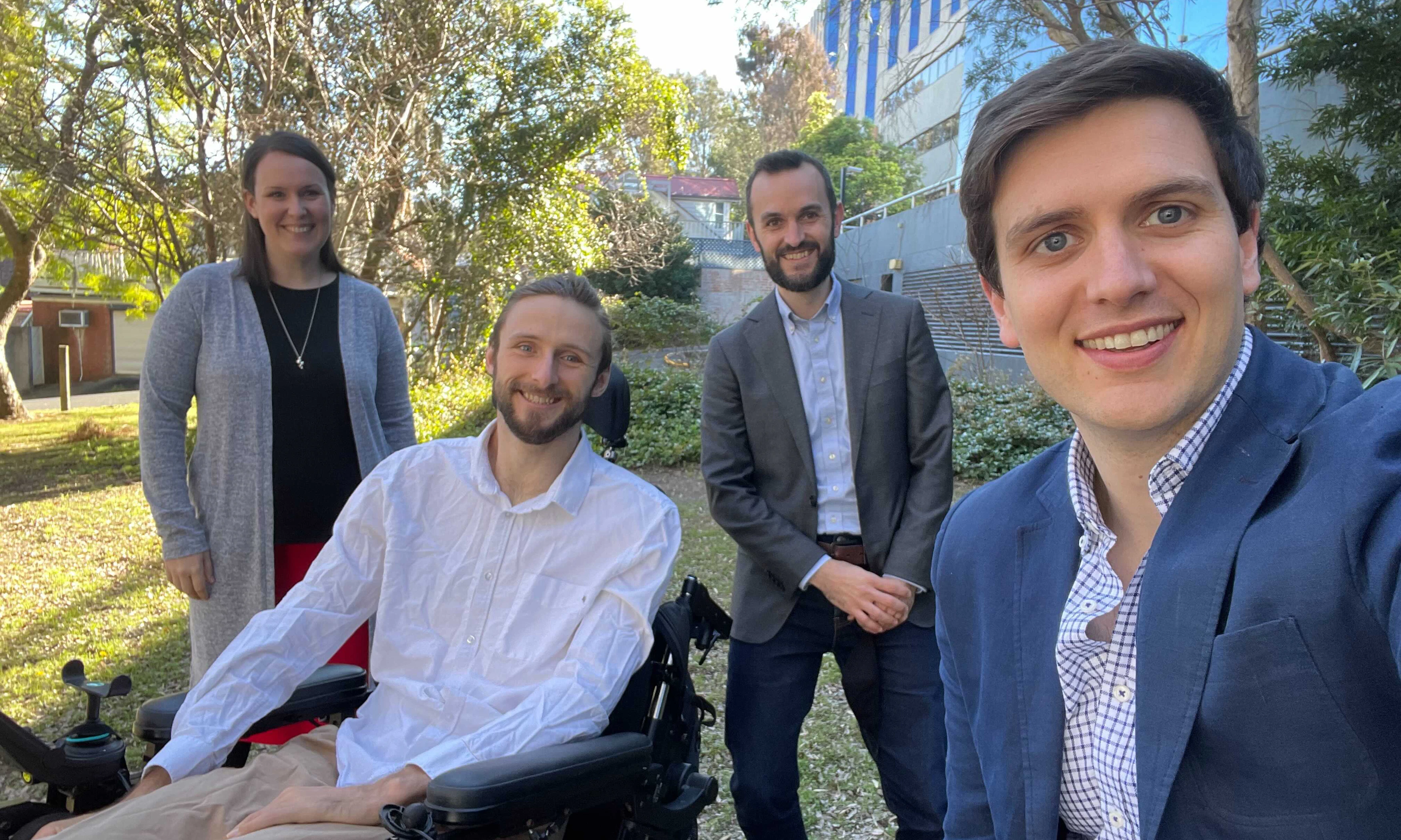 Hireup's first Board observer Steve Ralph with Hireup founders Jordan and Laura O'Reilly and Murray Bunton. They are outdoors with tress behind them.