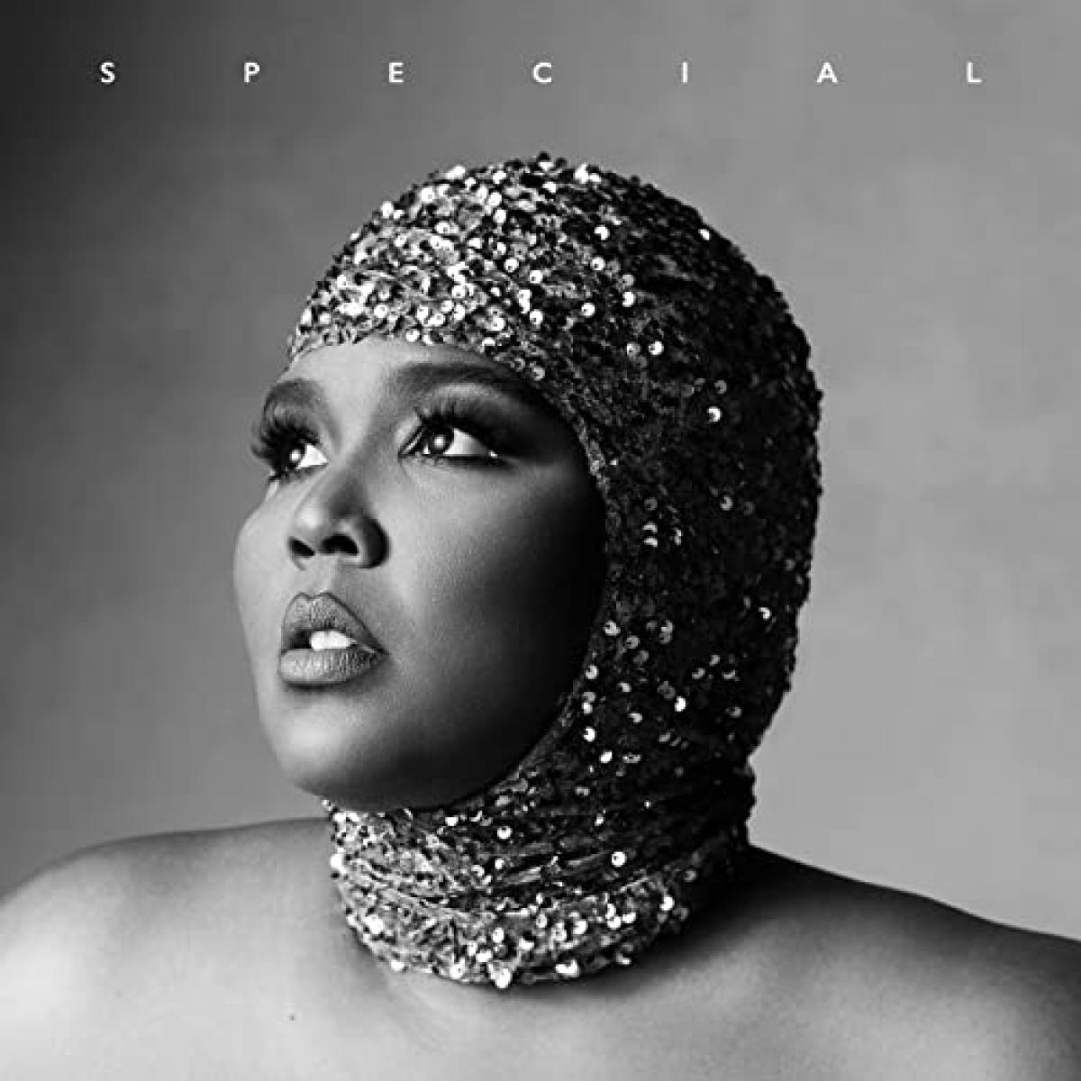 Lizzo's Special album cover features the American singer and rapper wearing a sequinned head cap, staring off to the right. The album cover is in black and white, and features the title, 'Special', across the top. 