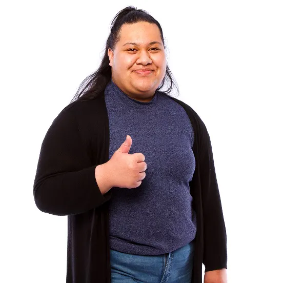 A woman smiling with a thumbs up
