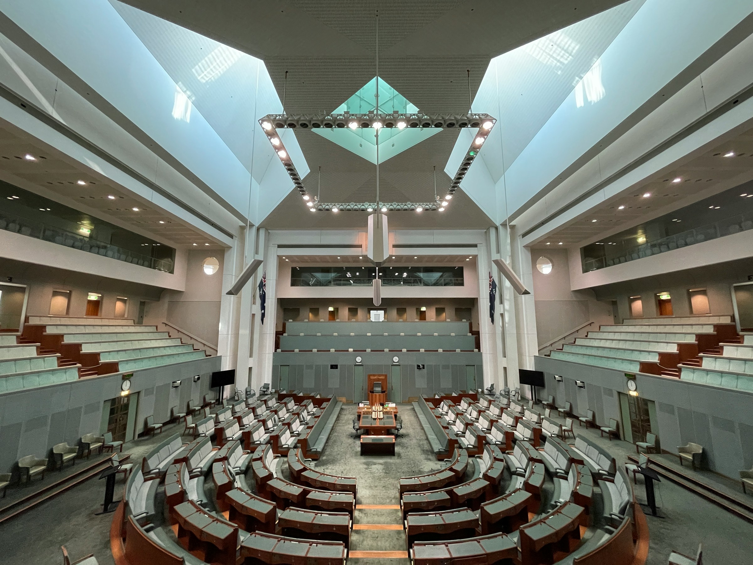 Australia's House of Representatives has 151 seats for each member, plus the Speaker's chair. At first floor level is the press gallery, there is also a public gallery. The House is eucalypt green. 