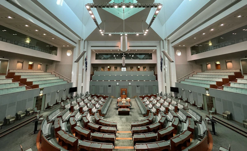 Australia's House of Representatives has 151 seats for each member, plus the Speaker's chair. At first floor level is the press gallery, there is also a public gallery. The House is eucalypt green.