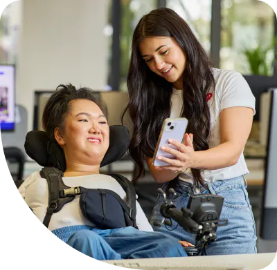 Hireup client Mel using the Hireup app with her support worker Allyah.