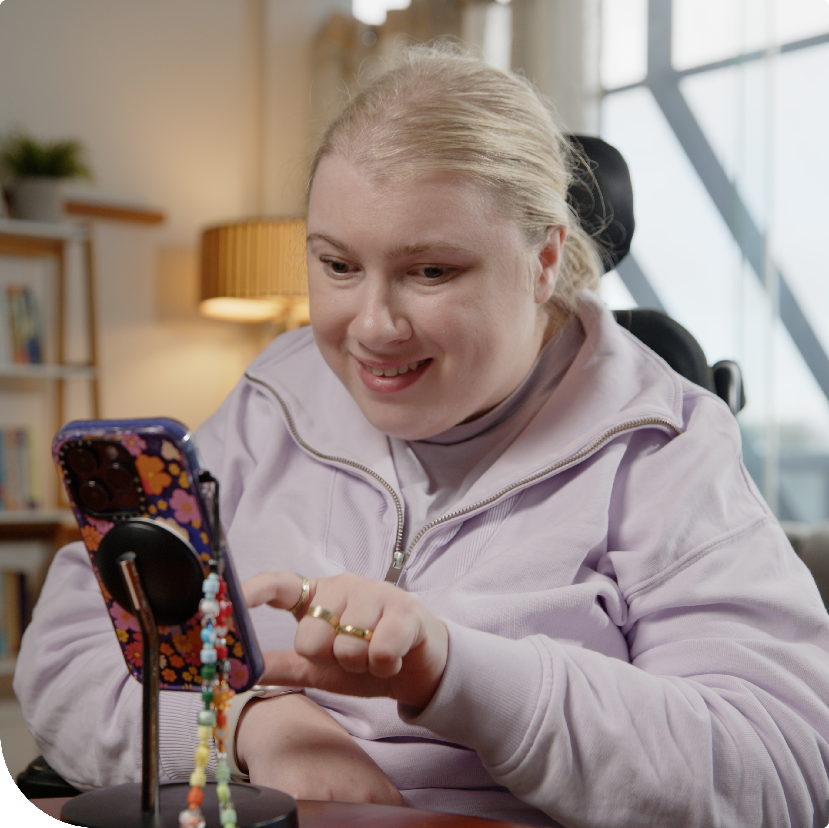 Client Sam using the Hireup app on her phone.