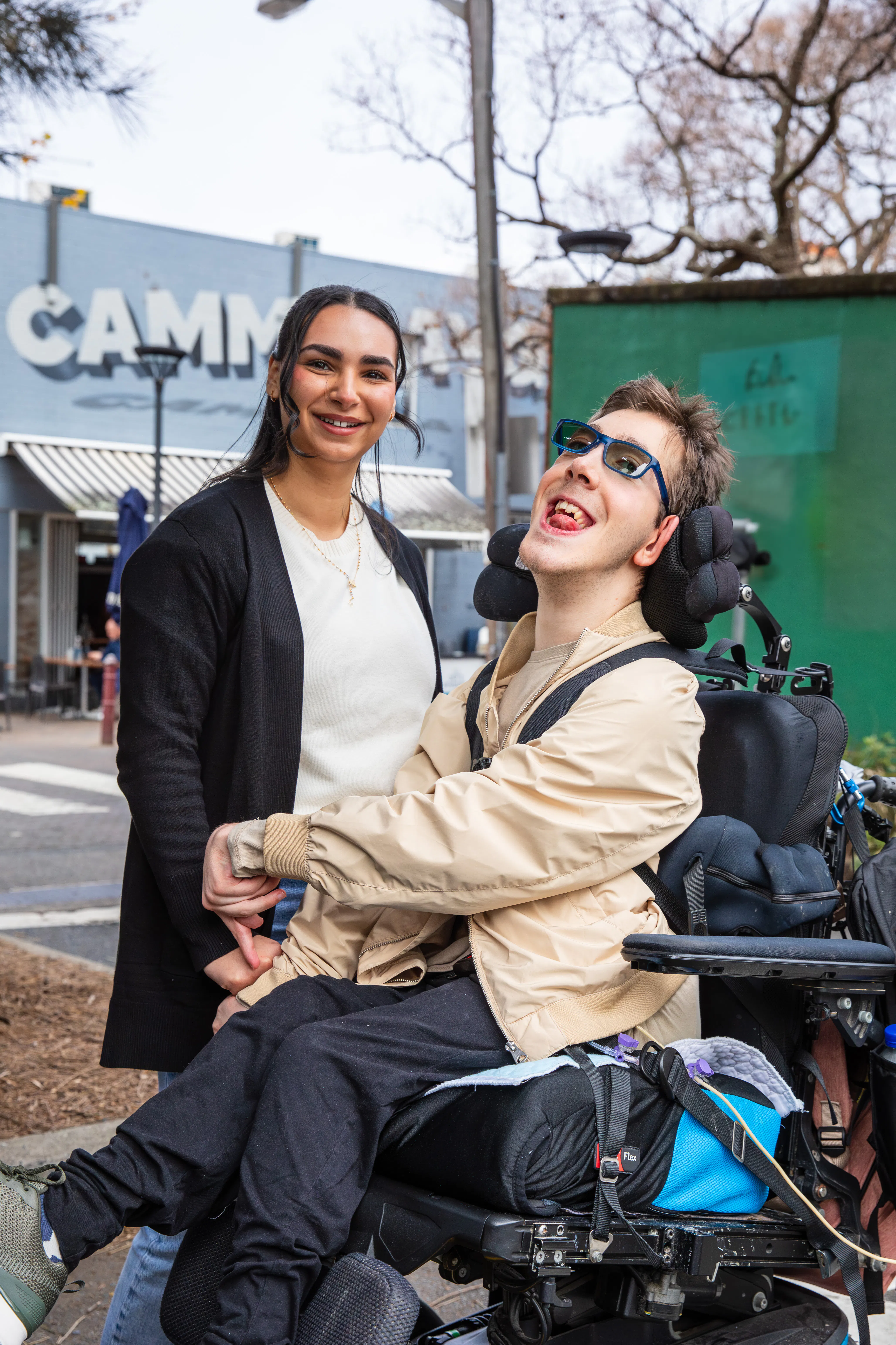 Al and his support worker Bec going to a cafe.