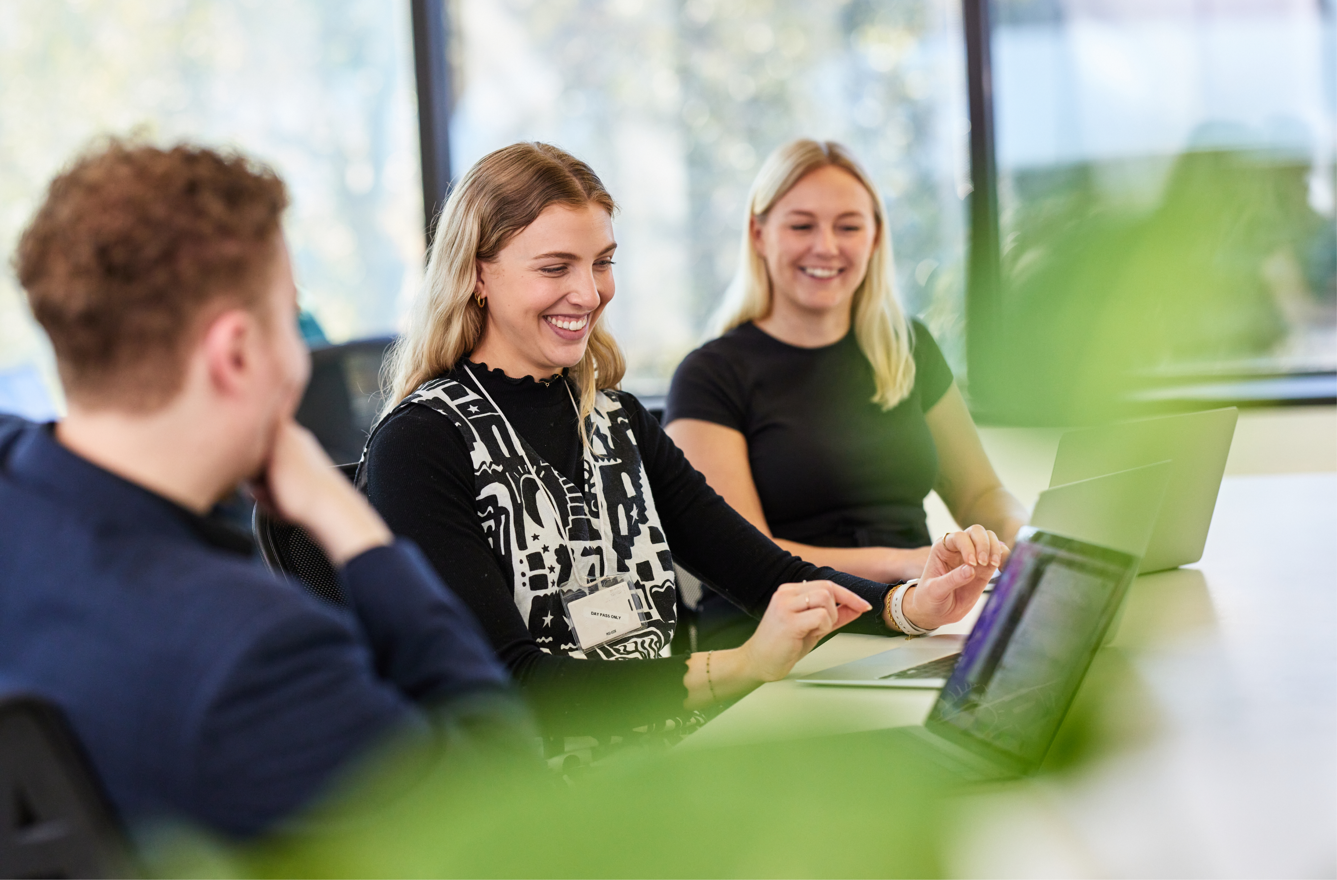 Members of the Hireup for Providers team working at their desks.