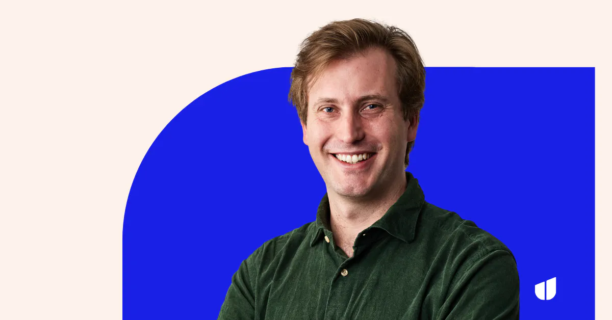A photo of Hireup CEO Peter Willis smiling at the camera. He is wearing a corduroy dark green shirt and has short light brown hair.