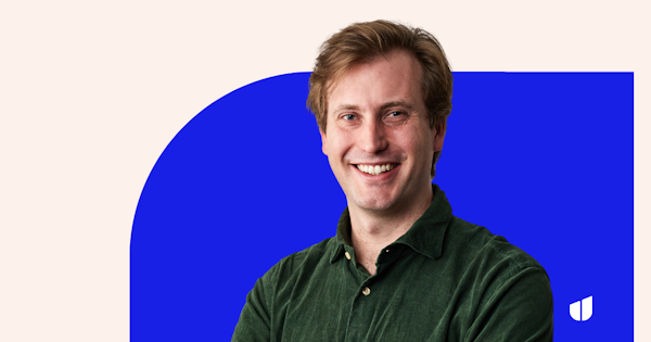 A photo of Hireup CEO Peter Willis smiling at the camera. He is wearing a corduroy dark green shirt and has short light brown hair.