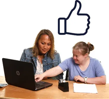 2 people using a laptop next to a thumbs up.