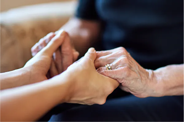 A support worker assisting a client during physical therapy.
