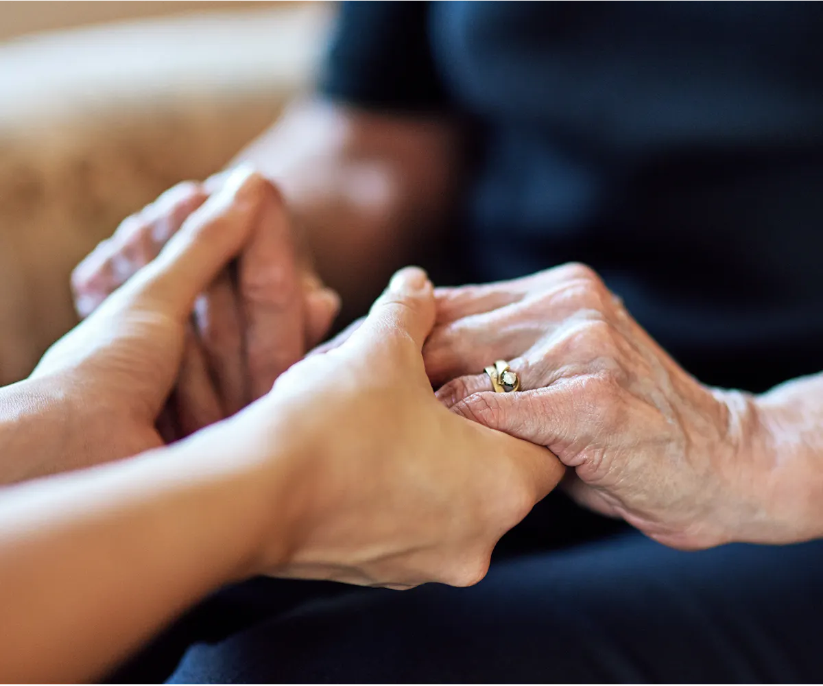 A support worker assisting a client during physical therapy.
