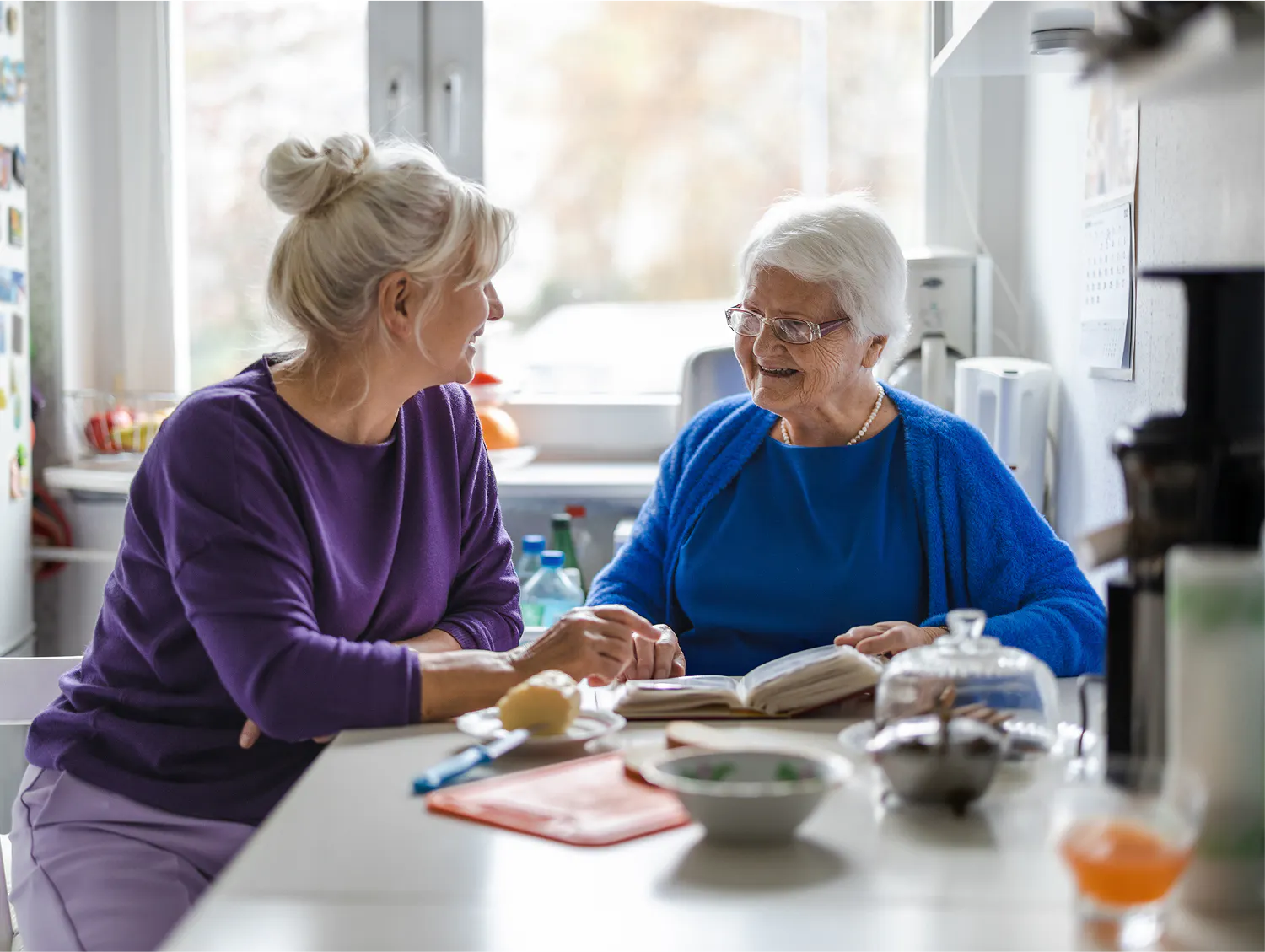 A support worker assisting a client during a meal.