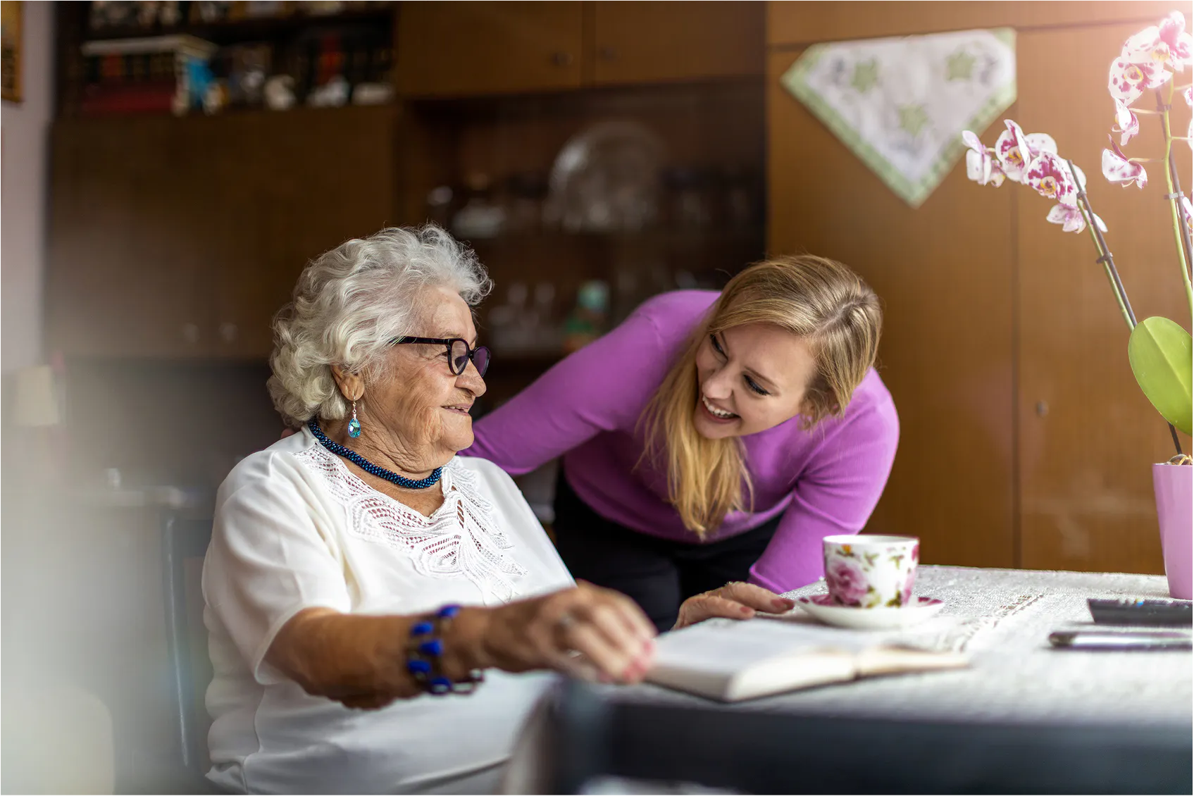 A support worker assisting a client at home.