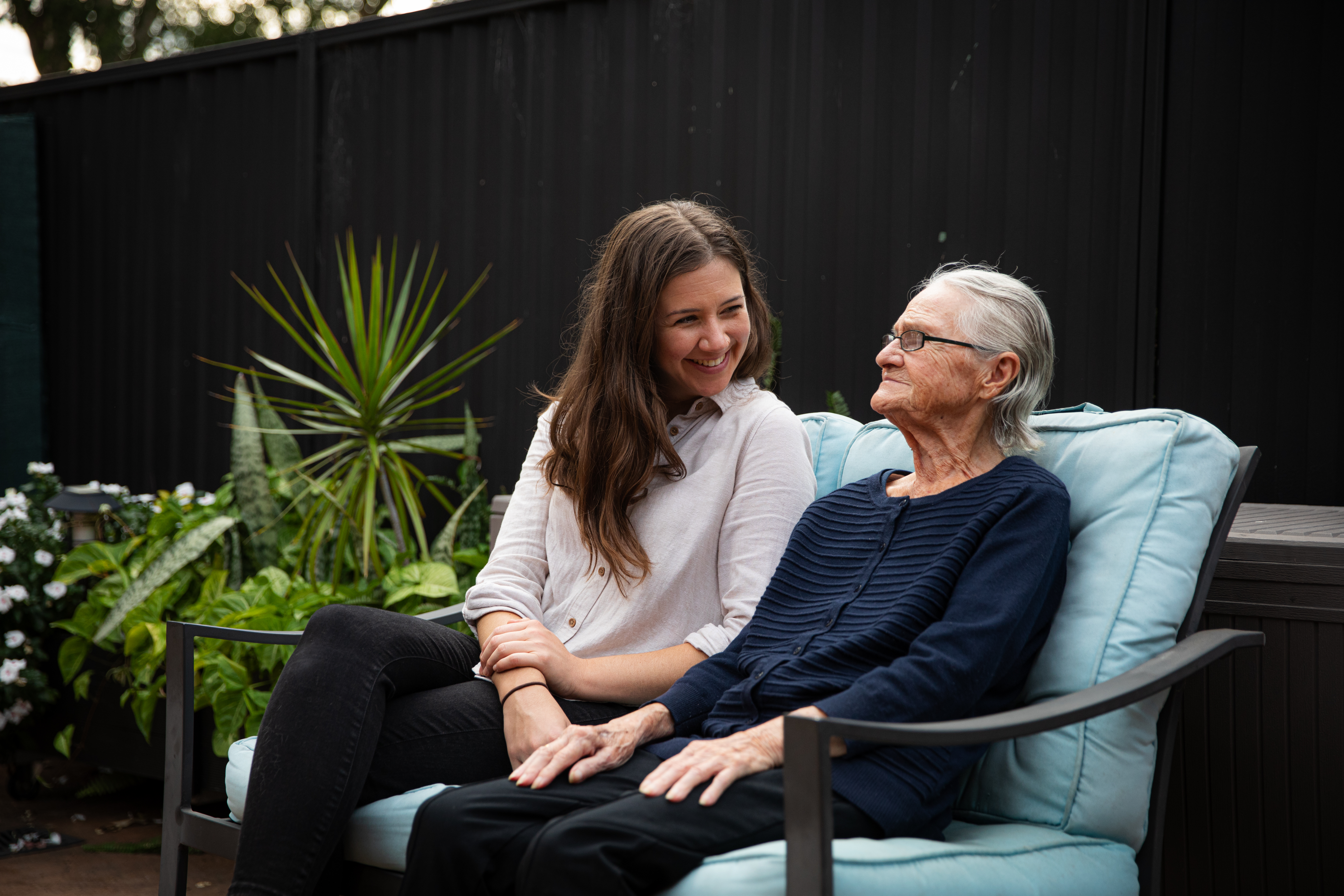 Support worker Michaela smiles with aged care client Victoria.