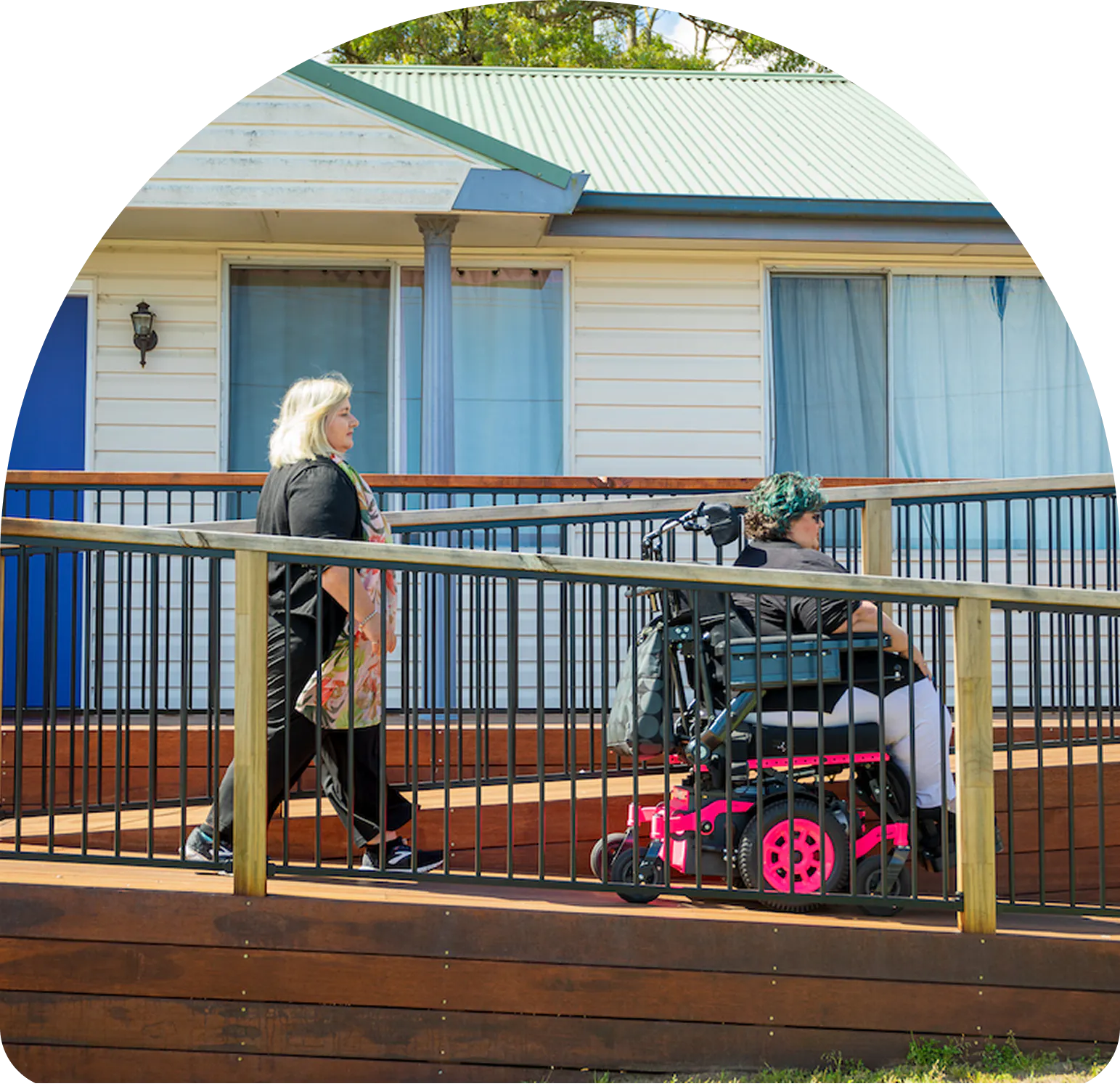A client uses a ramp to exit their home.