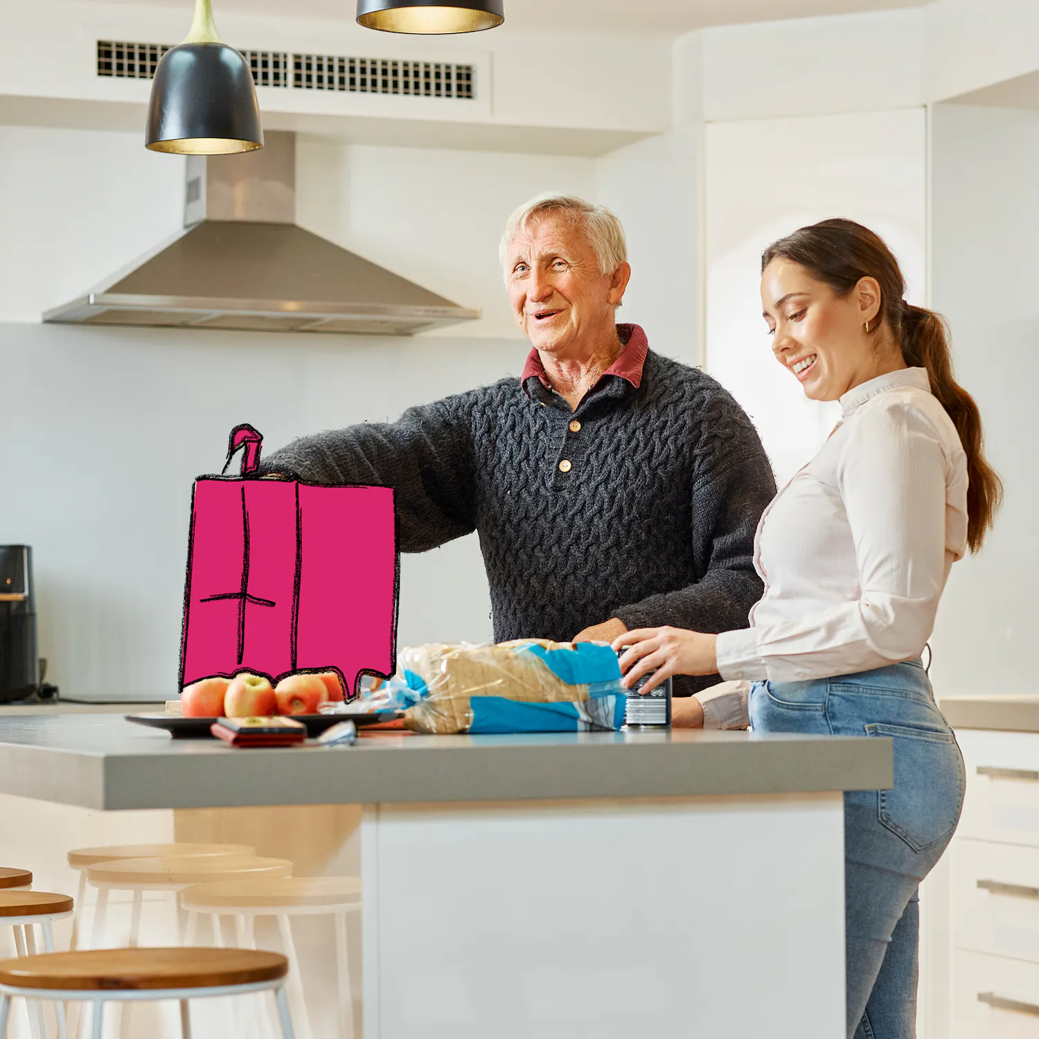 Hireup client Dirk and support worker Brenda unpack groceries on his kitchen bench.
